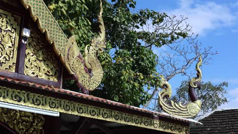 static view of ornate thai temple gable.