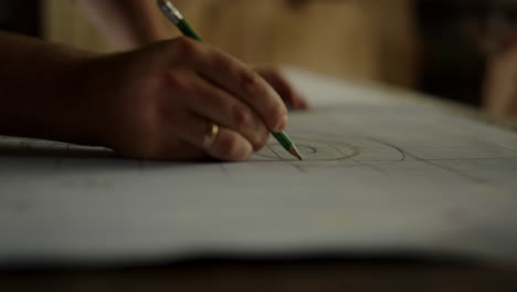 unknown guy getting ready to produce wooden product indoors. man hand designing