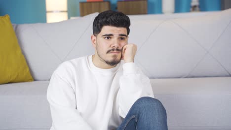 thoughtful and bored young man.