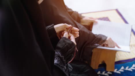 asian muslim woman praying and prostrating at home