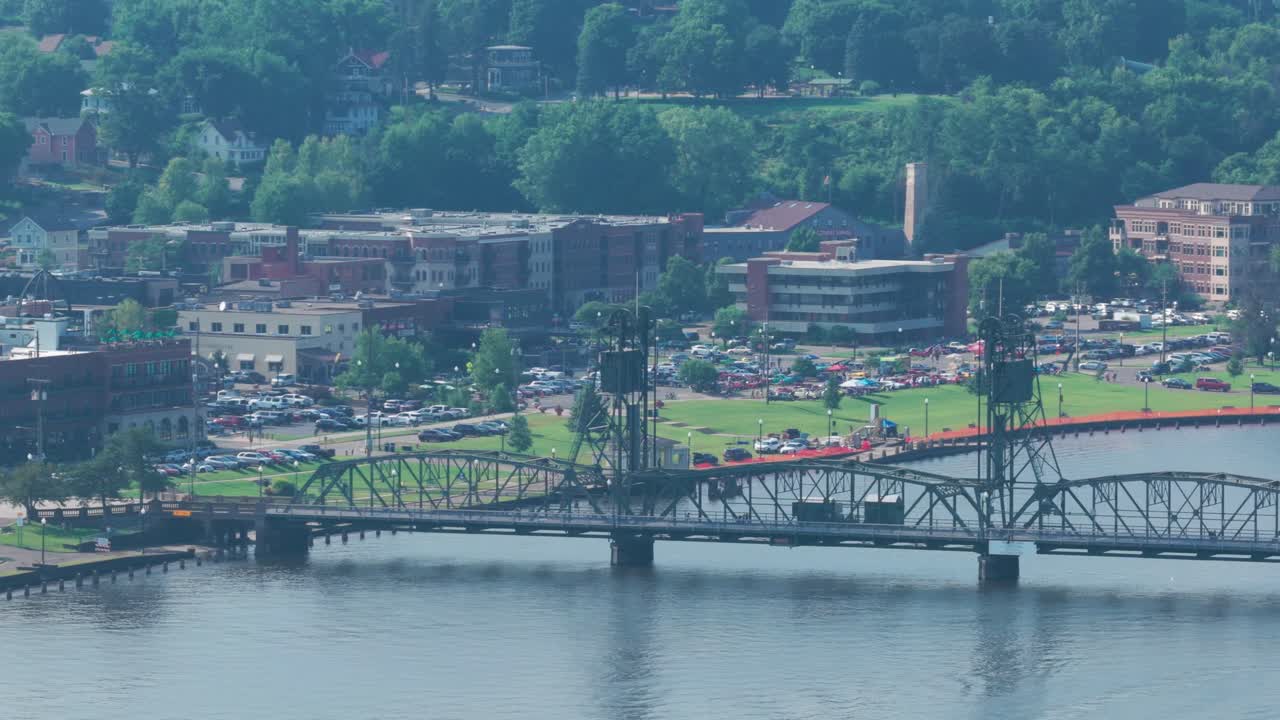 Telephoto panning aerial shot of the lift bridge over the St. Croix River in Stillwater, Minnesota. 4K