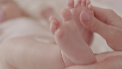 baby feet in loving hands