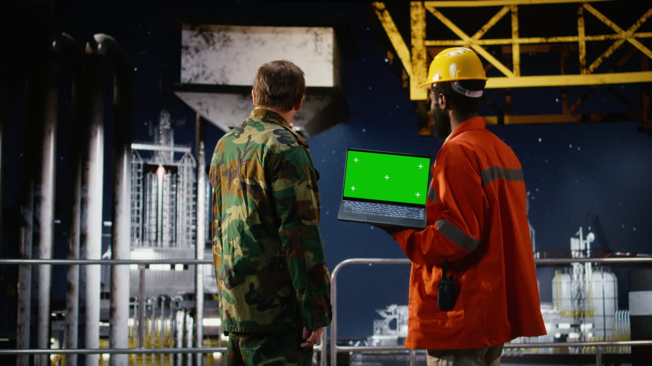 Chroma key laptop next to military soldier handling a maritime patrol