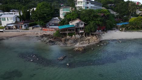 zoom in drone view of sea face resort in koh pangan, haad rin, thailand