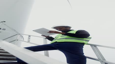 wind turbine technician inspecting