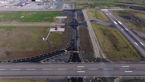 newly build fresh asphalt taxiway on iceland airport, aerial