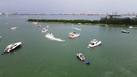 people vacationing on yachts and boats during summer in miami, florida - aerial
