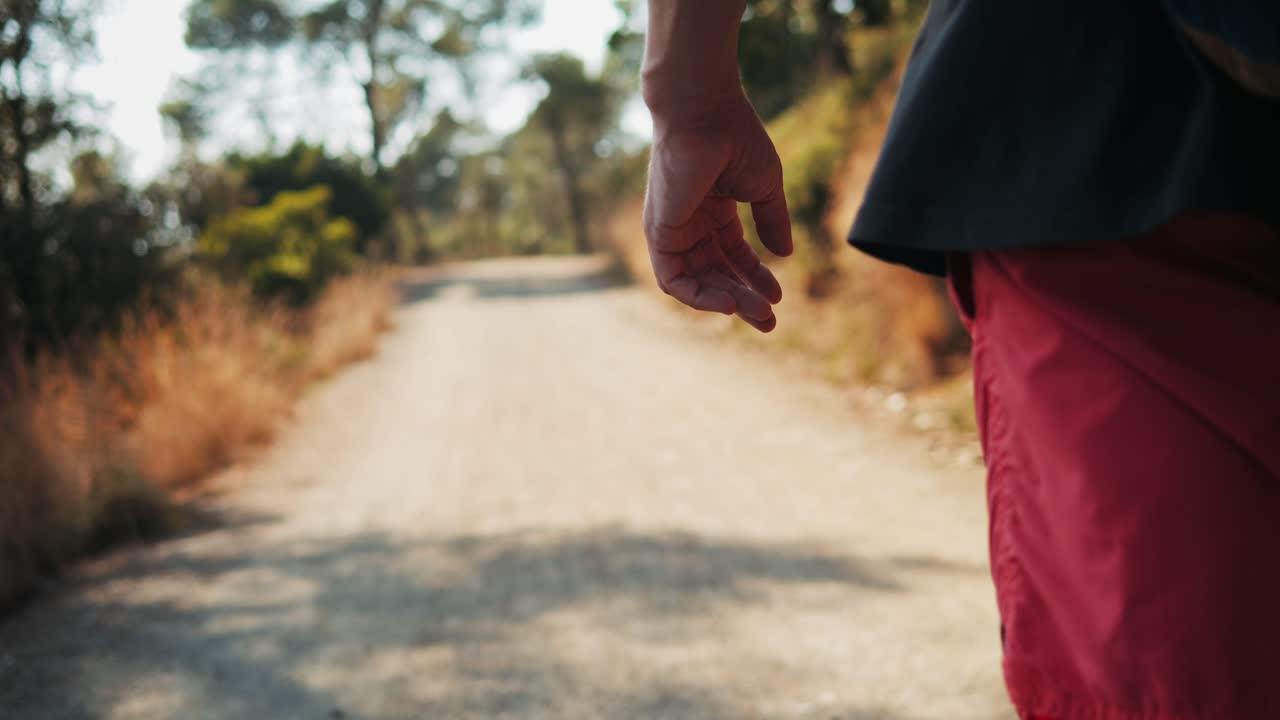 Man Hiking on a Trail