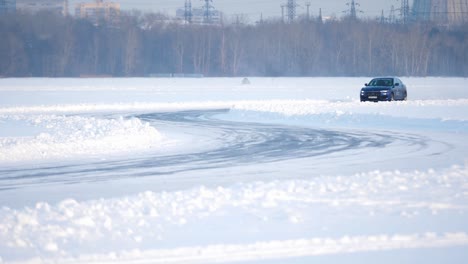 blue suv on a frozen lake