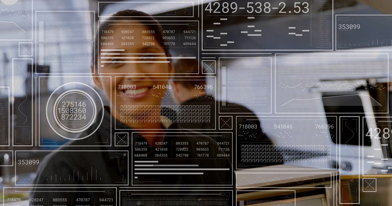 Server taking plates from cook inspecting smiling and carrying meals while HUD monitoring kitchen