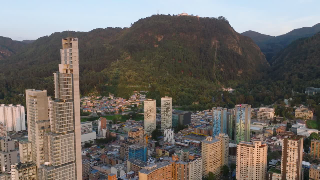 Drone shot over the city center of Bogota and the mountain of Monserrate