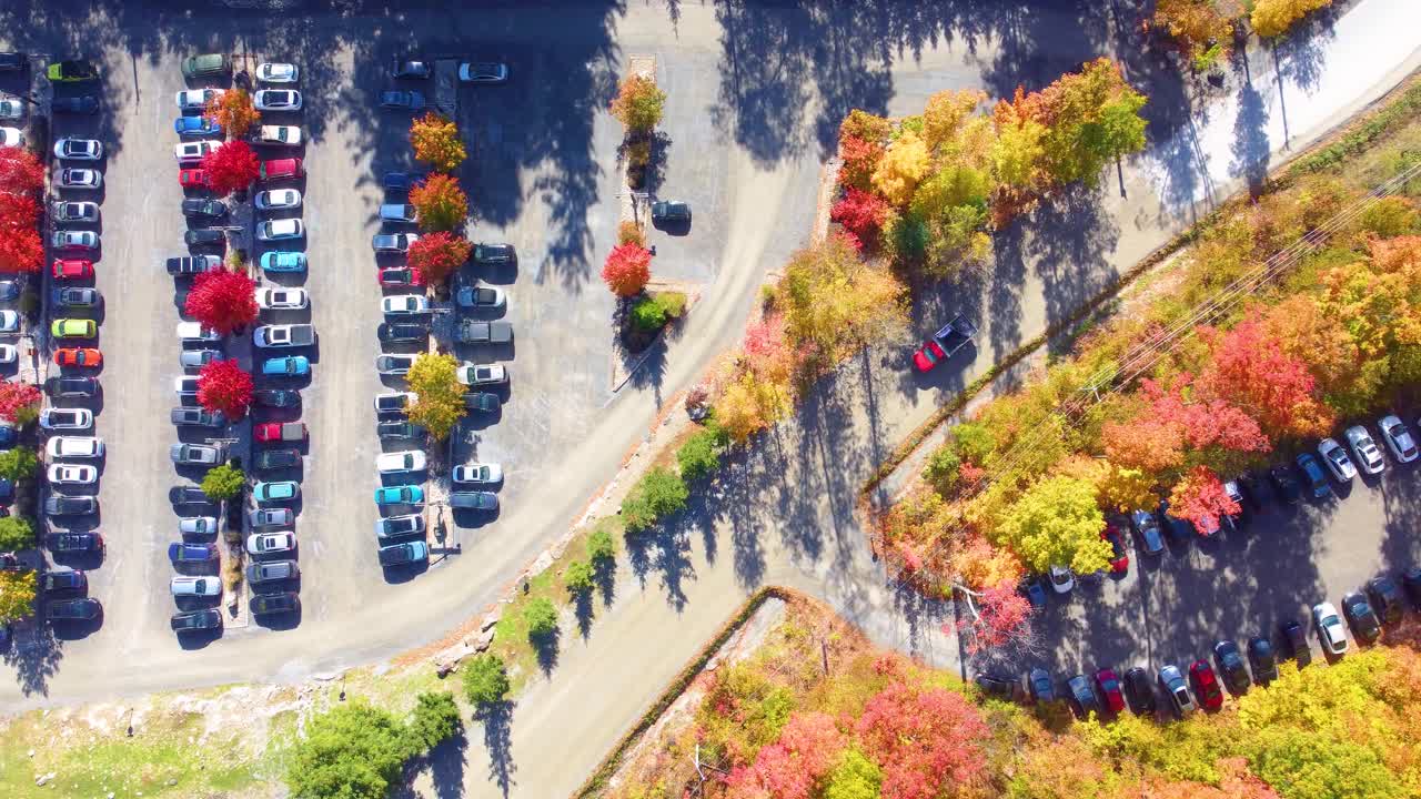 Parking lot in Quebec, surrounded by colorful autumn vegetation