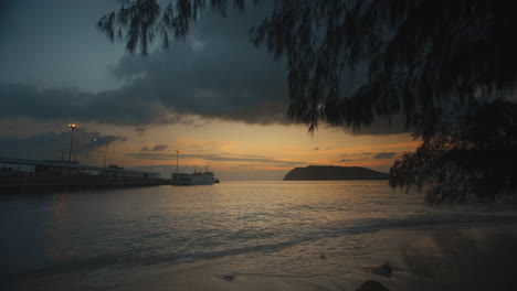 Time-lapse-with-sea-pier-view-boat-and-island-silhouette