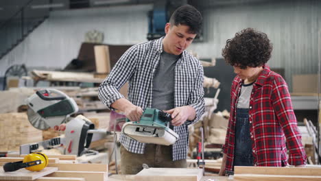 father and son learning woodworking