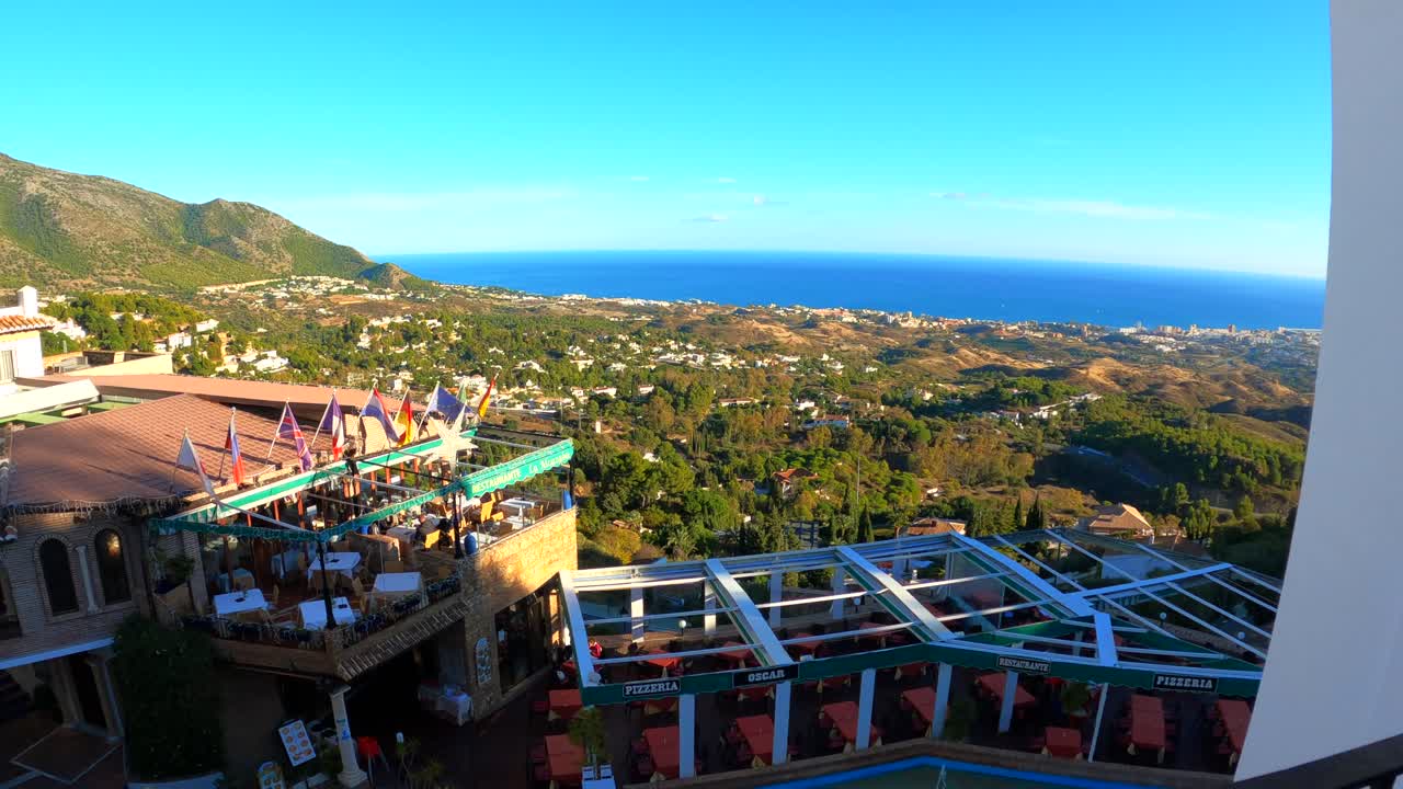 Through the stairs to the balcony with a beautiful view of the mountains and the sea, Spain