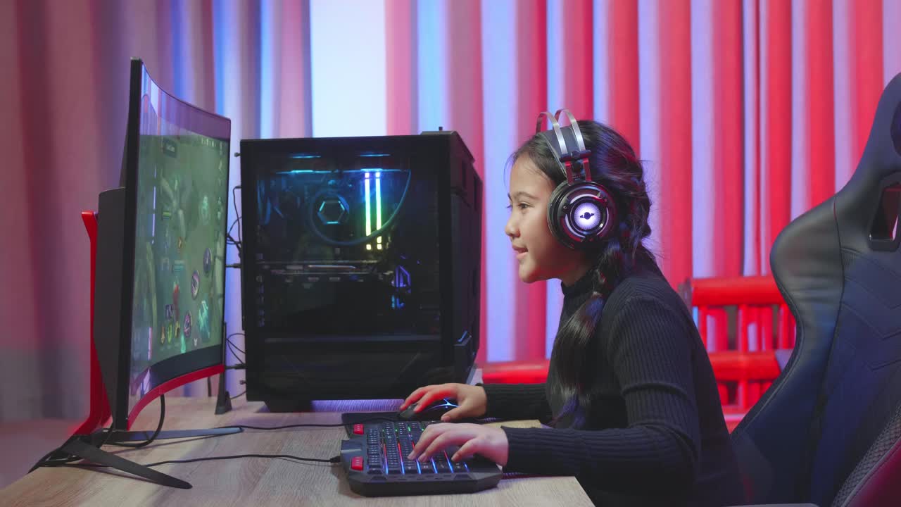Girl Playing Video Games on a Computer