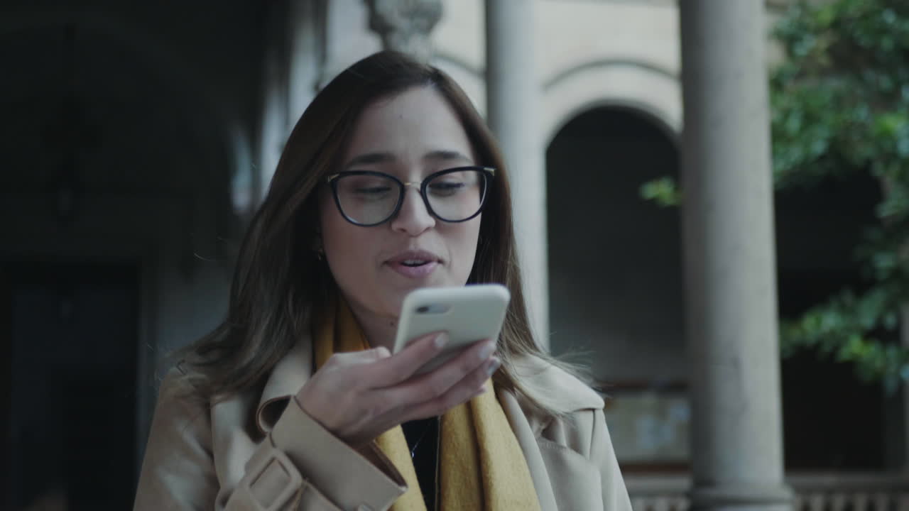 Student recording voice message on smartphone