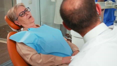 woman complaining about painful feelings in teeth