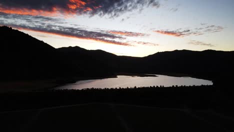 Aerial-shot-of-a-sunset-on-a-lake-in-Chile