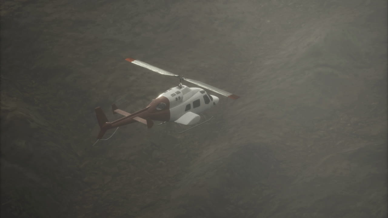 Helicopter flies low over rugged terrain during misty afternoon