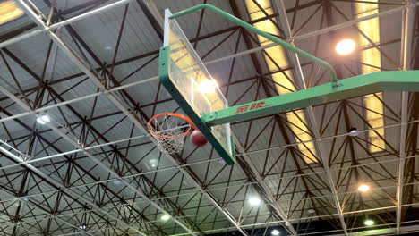 basketball ball going through hoop net, and court at park for outdoor game, shot or score point in hoop or match