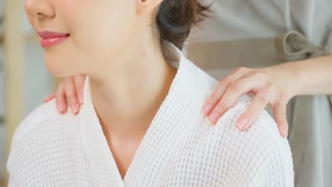 woman receiving a shoulder massage