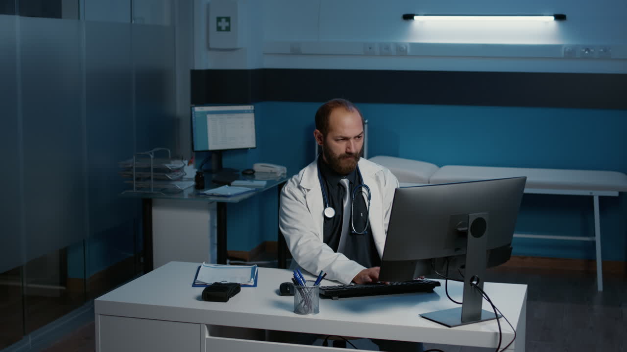 A doctor sitting at a desk in an office