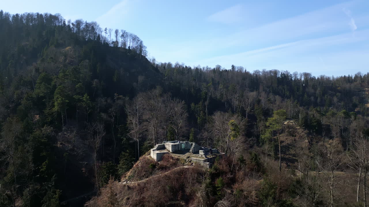 Aerial: Friesenberg ruins during the day in Friesenberg District, Zurich, Switzerland, crane up drone shot