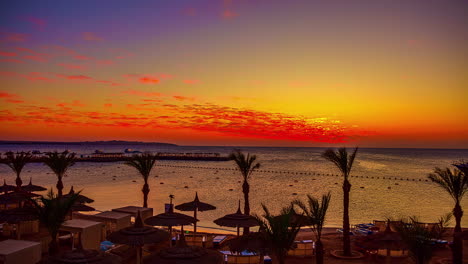 Sunset-in-tropical-resort-beach-with-palm-trees,-fusion-time-lapse