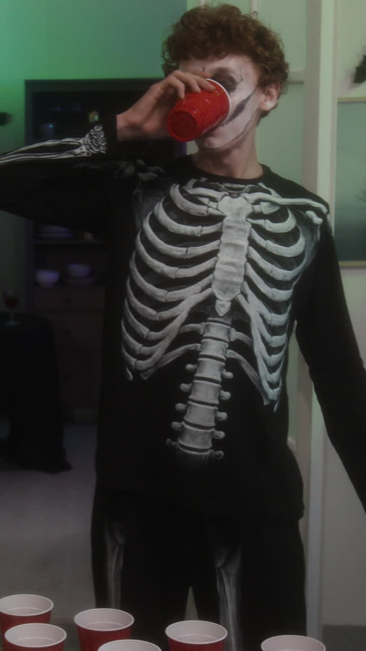 Halloween Party with Skeleton Costume and Red Cups