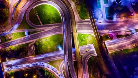 night timelapse aerial view of a freeway intersection traffic trails in night moscow