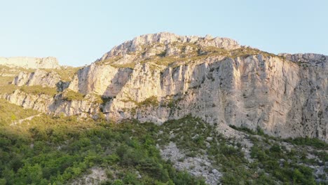 Traveling-on-a-mountain-at-sunrise,-drone-view