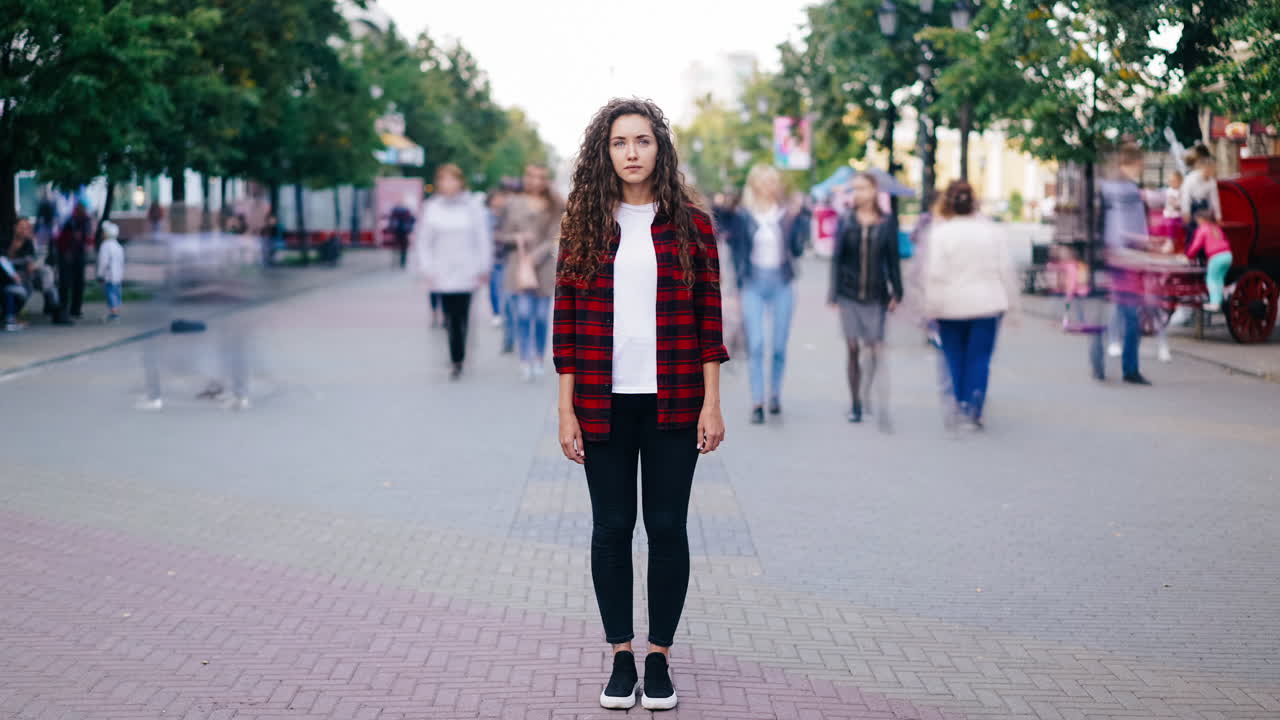 Woman standing in a crowd