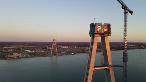 Gordie-Howe-Brigde-Suspension-tower-in-nice-evening-sun,-American-side,-Detroit,-Michigan,-Ascending-shot