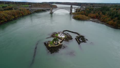 Aerial-orbiting-around-Red-Weir-Island-or-Ynys-Gored-Goch-in-Swellies-Strait-and-surrounding-landscape