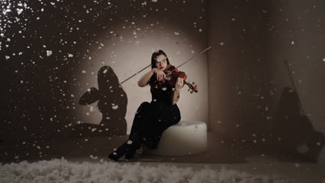 violinist playing in a winter studio setting