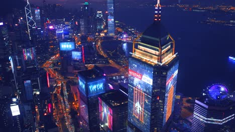 Aerial-view-of-digital-city-with-skyscraper-and-lighting-advertising-panels-at-night-in-Hong-Kong-City---Futuristic-concept-with-motion-graphic-and-digital-animation---Information-data-communication