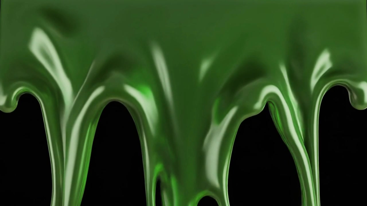 Dikke groene vloeistof druipend tegen een zwarte achtergrond