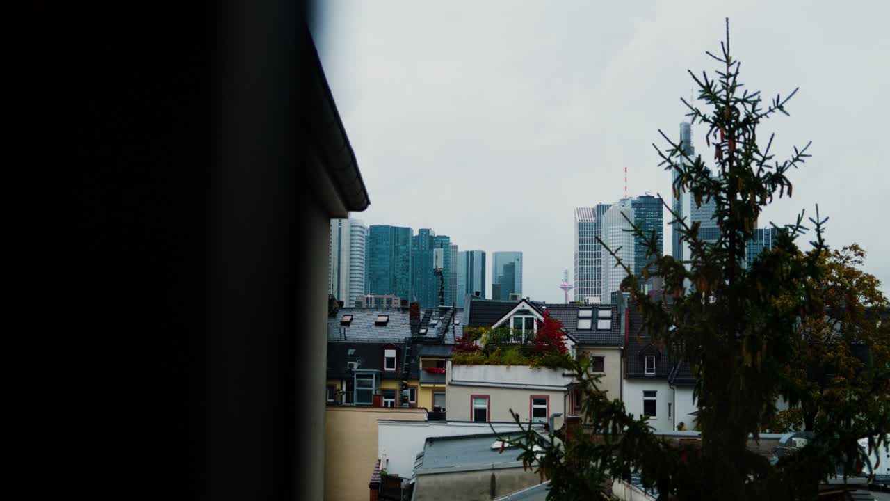 Frankfurt cityscape with high-rise buildings seen from a residential area on a cloudy day