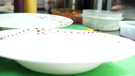 Drawing-and-decorating-food-plates,-close-up