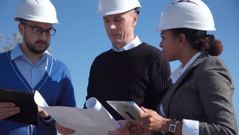 team of architects reviewing plans