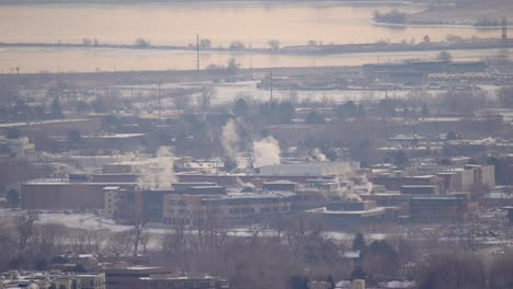 aerial view of smoke arising from industrial facilities