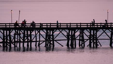 the mon bridge is an old wooden bridge located in sangkla, thailand