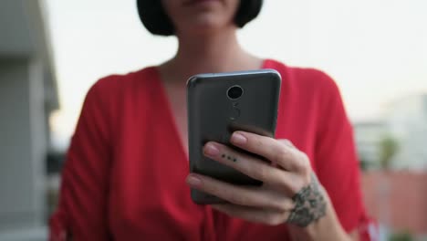 woman using mobile phone in balcony 4k