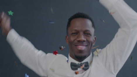 man celebrating with confetti