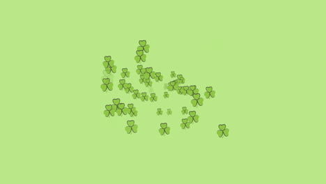 digital animation of multiple clover leaves forming against green background