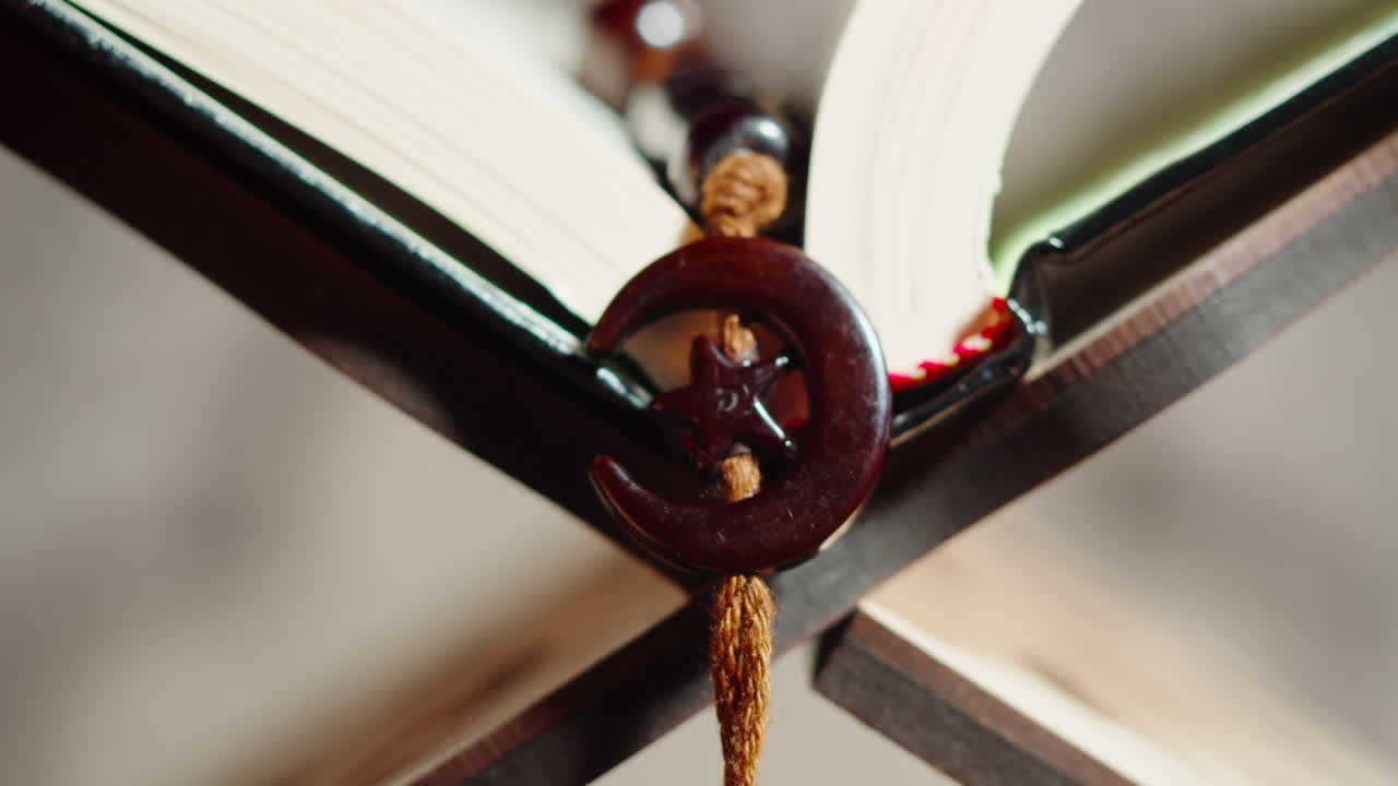 Quran book close-up, praying, islamic religion. Religious holiday Ramadan, holy month. Worship, making traditional prayer to God