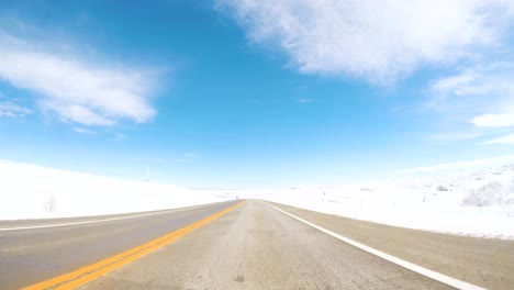 driving on suburban road after spring snow storm.