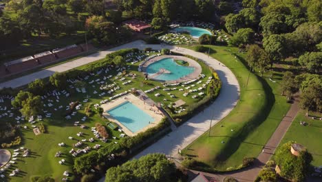 tilt down shot of beautiful swimming pools in amigos club resort, buenos aires, argentina