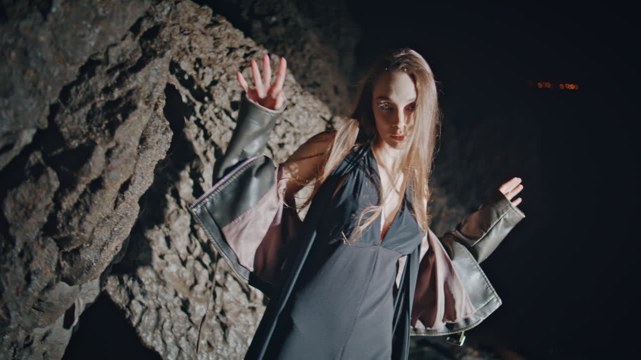 Sensual girl dancing night in cocktail dress closeup. Party lady enjoying rhythm